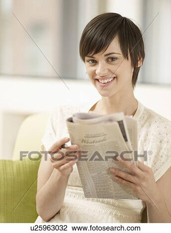 Young Woman Doing Crossword Puzzle View Large Photo Image Stock Image - Young Woman Doing Crossword Puzzle. Fotosearch