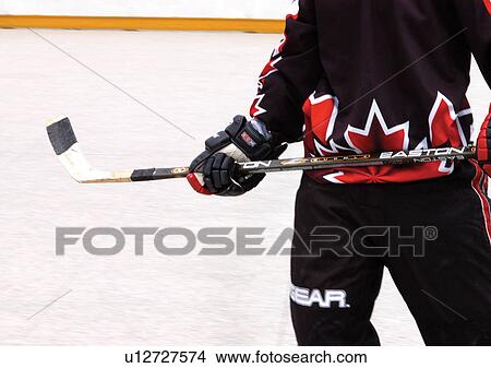 hockey puck, men, one person, people View Large Photo Image Picture - hockey puck, men, one person, people. Fotosearch