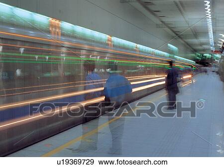 Blurred Motion, Commuters, Fast, Fluorescent Light, Group Of People View Large Photo Image Stock Photo - Blurred Motion, Commuters, Fast, Fluorescent Light, Group Of People. Fotosearch