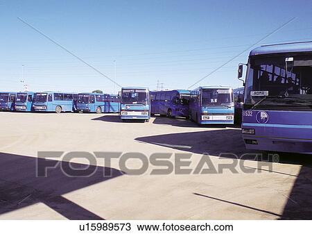 Stock Image - Blue, Bus, Bus Station, Clear Sky, Day, In A Row. Fotosearch