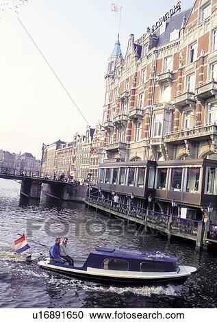 Stock Image - Bridge, Building Exterior, Day, Flags, Medium Group Of People. Fotosearch