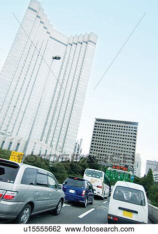 Stock Image - Building, Bus, Car, Day. Fotosearch