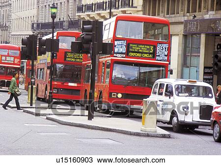 Stock Image - Building Exterior, Car, Day, Double Decker Bus, Headlights. Fotosearch