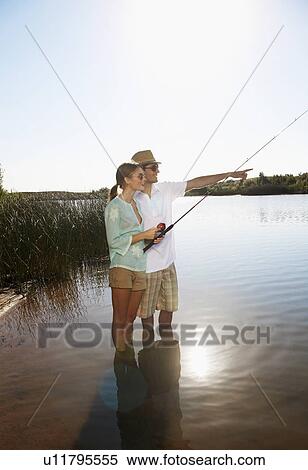 Young couple fly fishing View Large Photo Image Stock Photography - Young couple fly fishing. Fotosearch