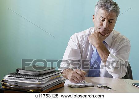 Stock Photo - Businessman making notes. Fotosearch