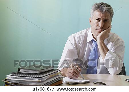 Stock Photo - Businessman making notes. Fotosearch