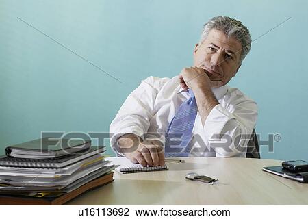 Businessman working late View Large Photo Image Stock Image - Businessman working late. Fotosearch