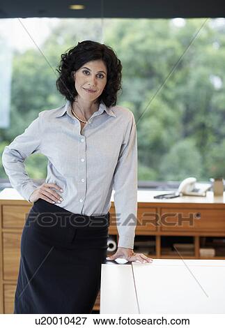 Mid adult businesswoman (portrait) View Large Photo Image Stock Photo - Mid adult businesswoman (portrait). Fotosearch
