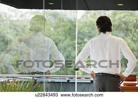 Mid Adult Man Looking Through Window View Large Photo Image Stock Image - Mid Adult Man Looking Through Window. Fotosearch