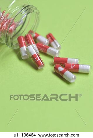 Picture - Love Tokens, Alphabet, Capsule, Close-Up, Colored Background. Fotosearch