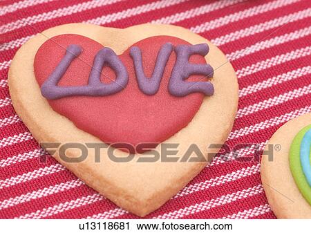 Stock Image - Love Tokens, Capital Letter, Close-Up, Cookie, Heart Shape. Fotosearch