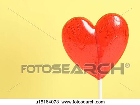 Stock Image - Love Tokens, Close-Up, Colored Background, Heart Shape. Fotosearch