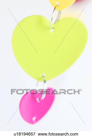 Love Tokens, Close-Up, Green, Hanging, Heart Shape View Large Photo Image Stock Photo - Love Tokens, Close-Up, Green, Hanging, Heart Shape. Fotosearch