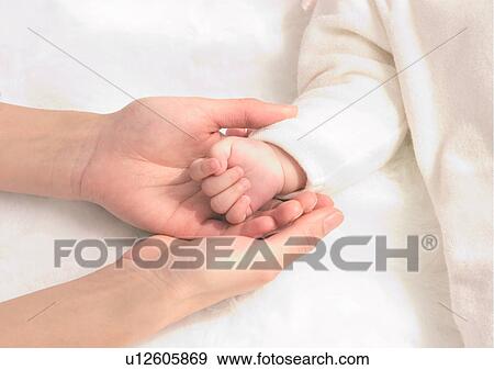 Stock Photo - Baby Boys, Holding Hands, Close-Up, About Babies. Fotosearch