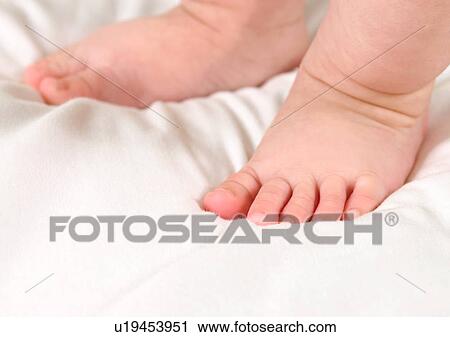 Stock Image - Barefoot, Focus On Foreground, Close-Up, About Babies. Fotosearch