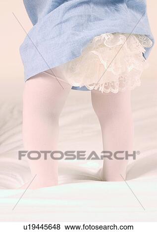 Stock Photo - Barefoot, Human Leg, Diaper, Close-Up, About Babies. Fotosearch
