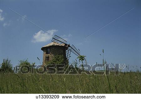 A Meadow And A Windmill In Spain View Large Photo Image Stock Photo - A Meadow And A Windmill In Spain. Fotosearch