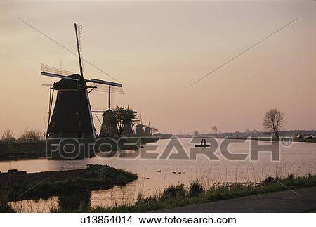 Picture - A Morning Glow And A Windmill In Netherlands. Fotosearch