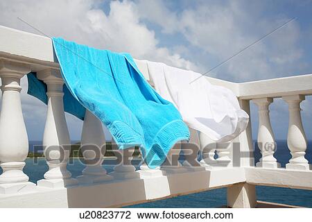 Two towels drying on railings View Large Photo Image Stock Image - Two towels drying on railings. Fotosearch