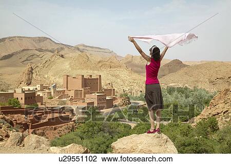 Woman Holding Up Scarf near Ruins View Large Photo Image Stock Image - Woman Holding Up Scarf near Ruins. Fotosearch