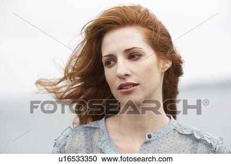 Woman with wind blown hair View Large Photo Image Stock Image - Woman with wind blown hair. Fotosearch