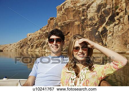 Young couple in boat View Large Photo Image Stock Photo - Young couple in boat. Fotosearch