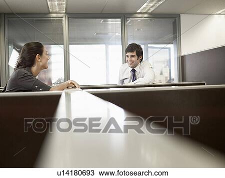 Office workers talking over partition walls View Large Photo Image Stock Image - Office workers talking over partition walls. Fotosearch