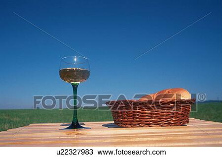 Stock Image - Bread And Wine On Picnic Table. Fotosearch