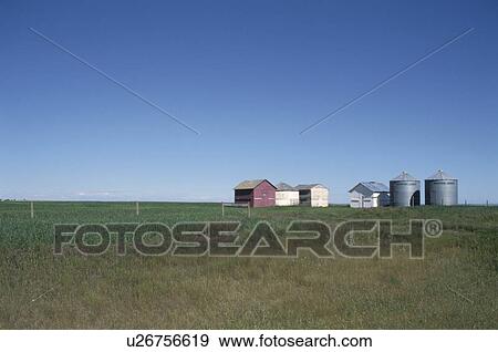 Stock Photo - The Silo And Hut In A Prairie. Fotosearch
