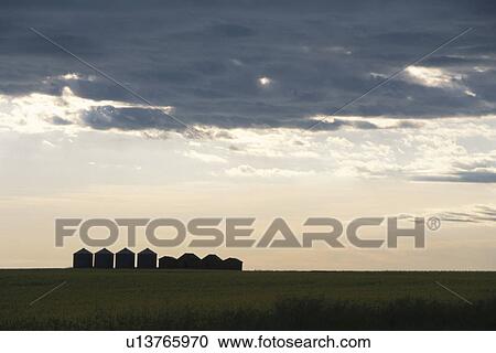 Stock Image - The Sky At Sunset And Silo Canada. Fotosearch