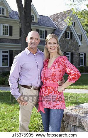 Mature couple near house, Chatham, New Jersey, USA View Large Photo Image Stock Photography - Mature couple near house, Chatham, New Jersey, USA. Fotosearch