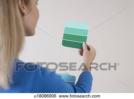 Mature woman looking at color swatches View Large Photo Image Stock Photograph - Mature woman looking at color swatches. Fotosearch