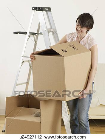 Young Woman Carrying Cardboard Box View Large Photo Image Stock Image - Young Woman Carrying Cardboard Box. Fotosearch