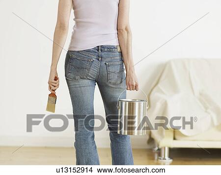 Young Woman Holding Paint Can and Brush View Large Photo Image Picture - Young Woman Holding Paint Can and Brush. Fotosearch