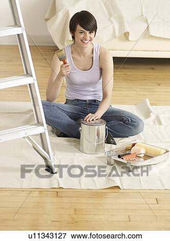 Young Woman with Painting Tools View Large Photo Image Stock Photo - Young Woman with Painting Tools. Fotosearch