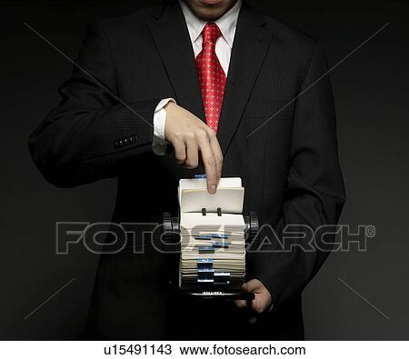 Stock Image - Businessman Using Rotary File. Fotosearch