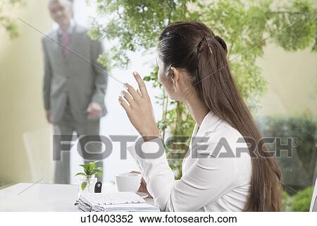 Businesswoman and businessman meeting in café View Large Photo Image Stock Image - Businesswoman and businessman meeting in café. Fotosearch
