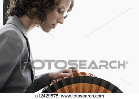 Stock Photography - Businesswoman searching rotary file. Fotosearch