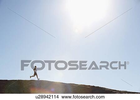 Picture - Sun over runner. Fotosearch