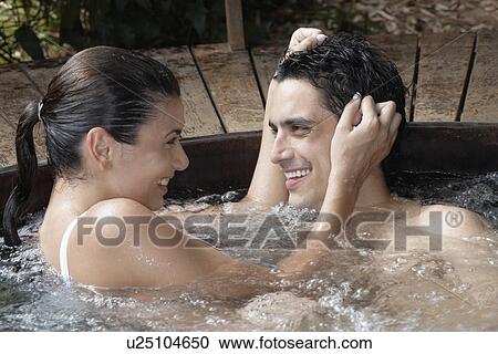 Young couple embracing in Jacuzzi View Large Photo Image Stock Image - Young couple embracing in Jacuzzi. Fotosearch
