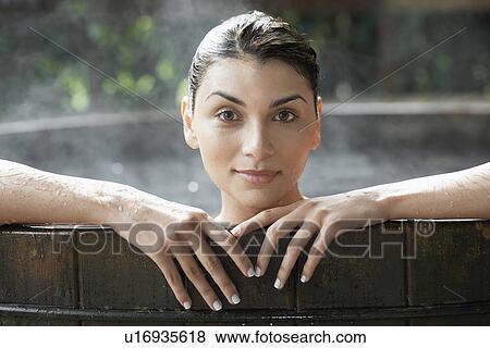 Stock Photo - Young woman in Jacuzzi (portrait). Fotosearch