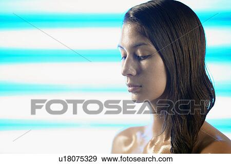 Young woman sweating View Large Photo Image Stock Photo - Young woman sweating. Fotosearch