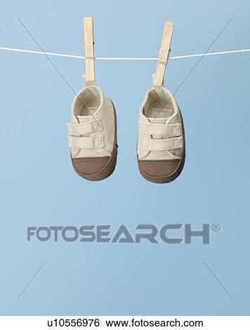 Baby Sneakers on Clothes Line View Large Photo Image Stock Photograph - Baby Sneakers on Clothes Line. Fotosearch