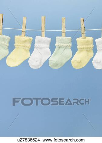 Picture - Baby Socks on Clothes Line. Fotosearch