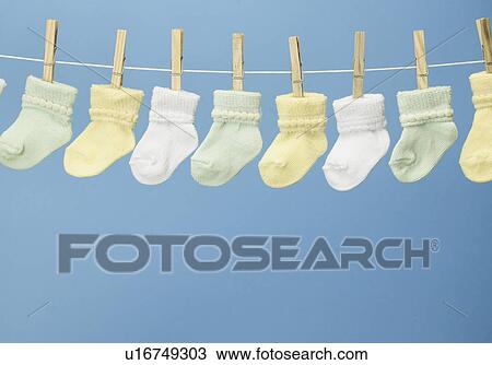 Stock Image - Baby Socks on Clothes Line. Fotosearch