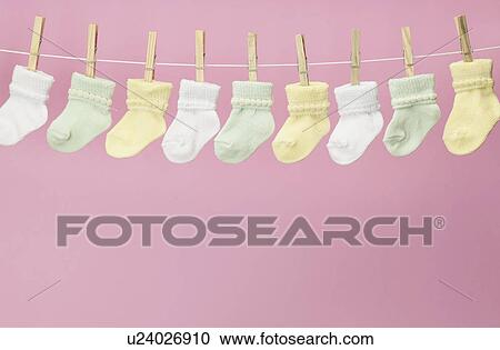 Stock Image - Baby Socks on Clothes Line. Fotosearch