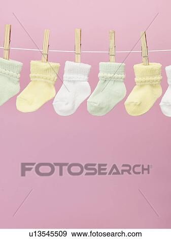 Stock Photo - Baby Socks on Clothes Line. Fotosearch