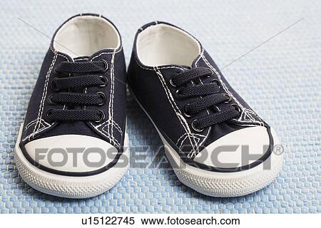 Stock Photography - Blue baby sneakers. Fotosearch
