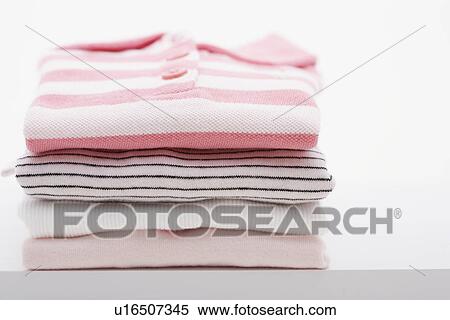 Folded baby clothes View Large Photo Image Stock Photography - Folded baby clothes. Fotosearch