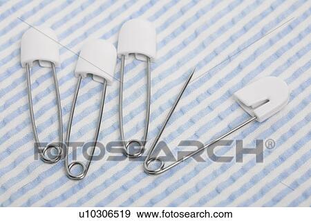 Stock Photo - Four napkin pins. Fotosearch